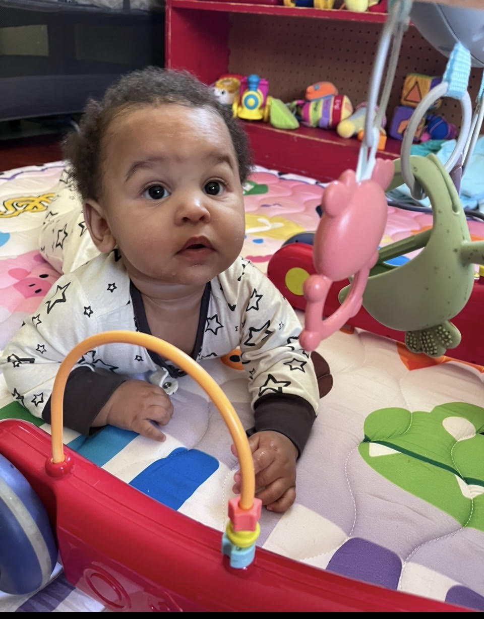 Nurturing infant care in Havana, Florida — baby exploring sensory toys at Teresa Delores Educational & Developmental Center